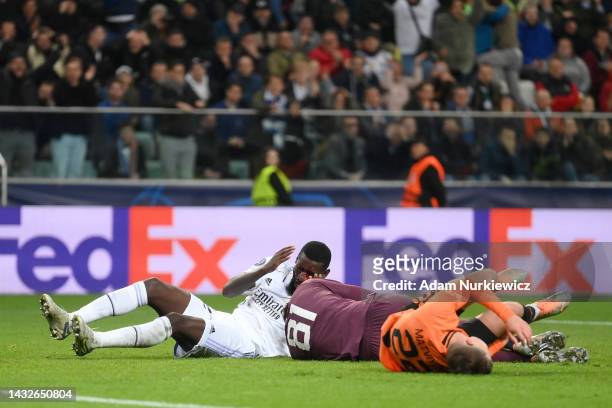 Antonio Rudiger of Real Madrid is seen injured after clashing with Anatoliy Trubin of Shakhtar Donetsk during the UEFA Champions League group F match...
