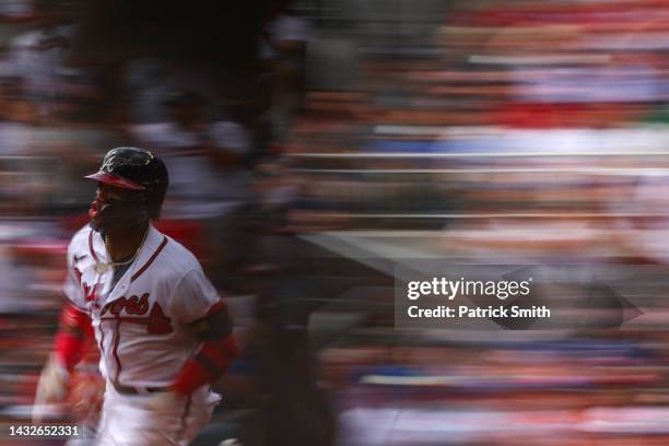 Ronald Acuna Jr. #13 of the Atlanta Braves rounds the bases after hitting a double against the Philadelphia Phillies during the first inning in game...