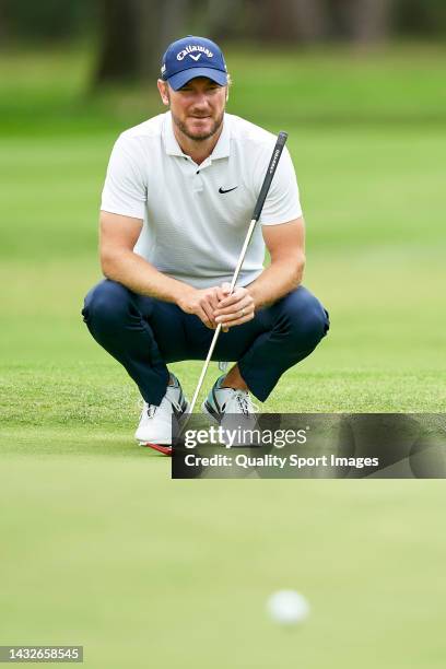 Chris Wood of England studies his shot during Day Four of the Acciona Open de Espana presented by Madrid at Club de Campo Villa de Madrid on October...