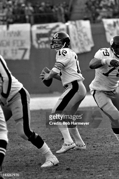 Quarterback Terry Bradshaw of the Pittsburgh Steelers prepares to pass against the Denver Broncos on December 16 at Mile High Stadium in Denver,...