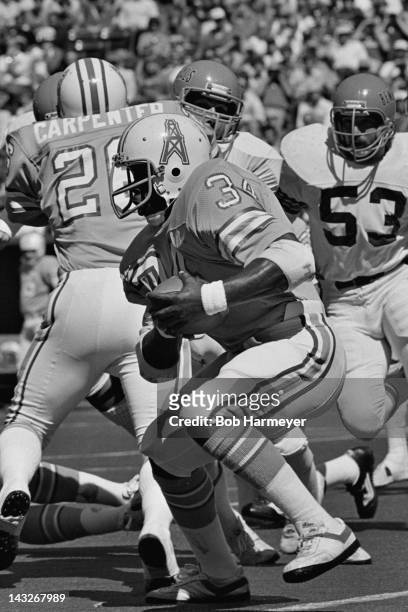 Running back Earl Campbell of the Houston Oilers carries the ball against the Cincinnati Bengals on September 23 at Riverfront Stadium in Cincinnati,...