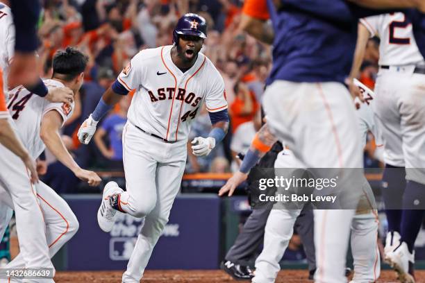 Yordan Alvarez of the Houston Astros celebrates after hitting a walk-off home run against the Seattle Mariners during the ninth inning in game one of...