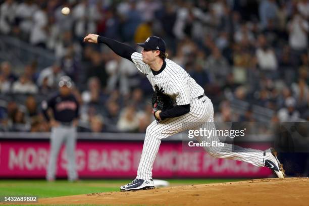 Gerrit Cole of the New York Yankees throws a pitch against the Cleveland Guardians during the first inning in game one of the American League...