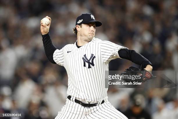 Gerrit Cole of the New York Yankees throws a pitch against the Cleveland Guardians during the first inning in game one of the American League...