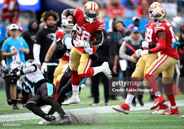 Tevin Coleman of the San Francisco 49ers gets tackled by Juston Burris and Cory Littleton of the Carolina Panthers in the second quarter at Bank of...