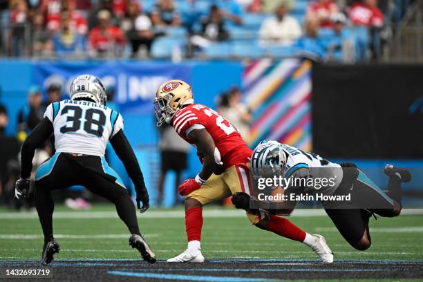 Jeff Wilson Jr. #22 of the San Francisco 49ers is tackled by Juston Burris of the Carolina Panthers during the third quarter at Bank of America...