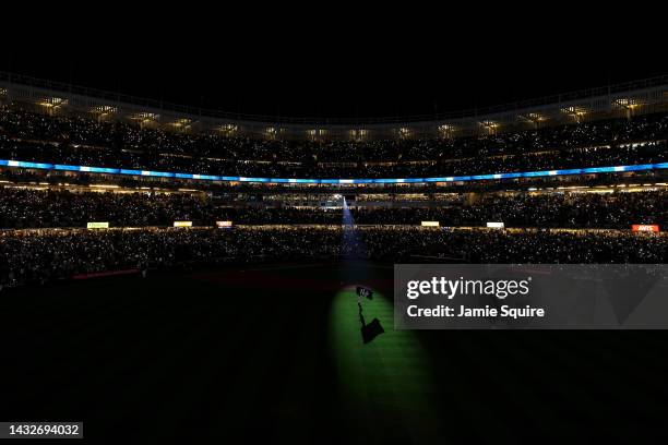 Former New York Yankees Nick Swisher runs on the field with a Yankees Flag prior to game one of the American League Division Series against the...