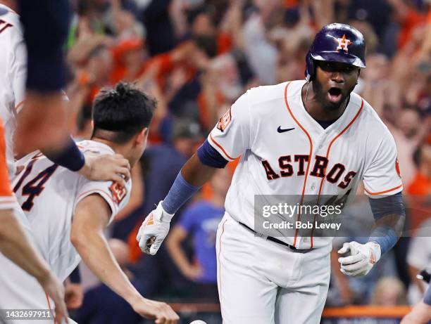 Yordan Alvarez of the Houston Astros celebrates after hitting a walk-off home run against the Seattle Mariners during the ninth inning in game one of...