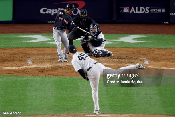 Steven Kwan of the Cleveland Guardians hits a solo home run against Gerrit Cole of the New York Yankees during the third inning in game one of the...