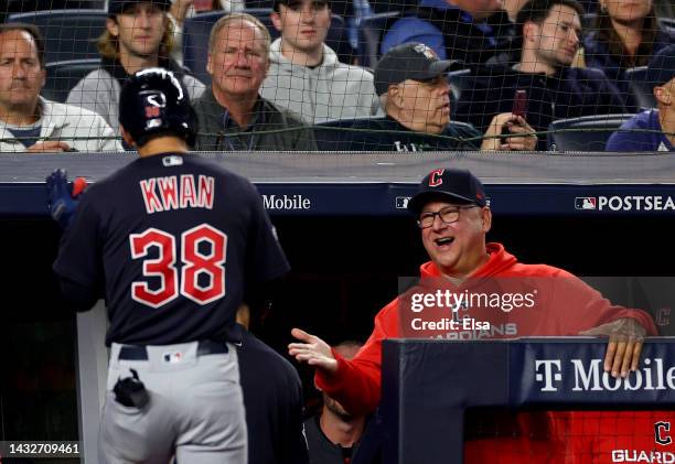 Steven Kwan of the Cleveland Guardians celebrates with manager Terry Francona after hitting a solo home run against Gerrit Cole of the New York...