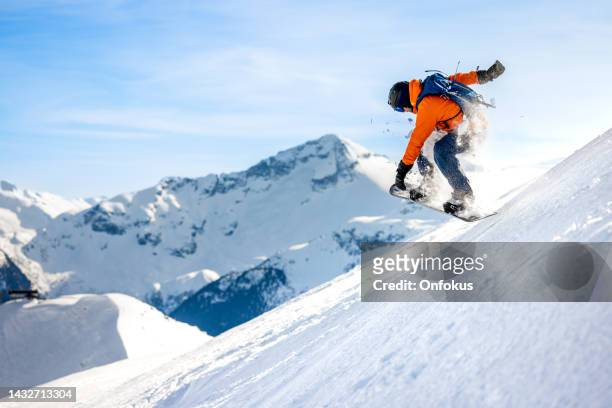 man skier in action in backcountry area with fresh powder snow at whistler-blackcomb ski resort - whistler stockfoto's en -beelden