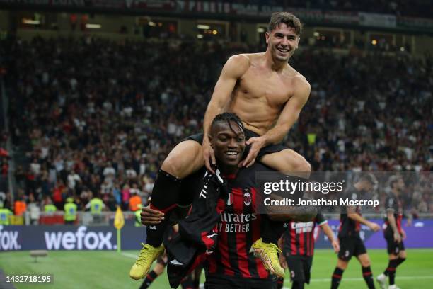 Brahim Diaz of AC Milan celebrates on the shoulders of team mate Rafael Leao after scoring to give the side a 2-0 lead during the Serie A match...