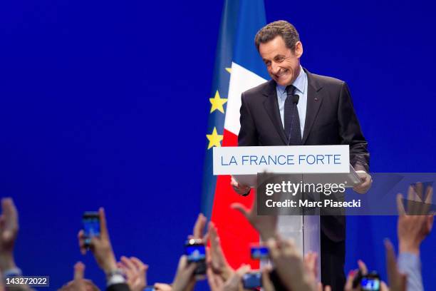 France's President and Union for a Popular Movement candidate for the 2012 presidential election Nicolas Sarkozy delivers a speech after the first...