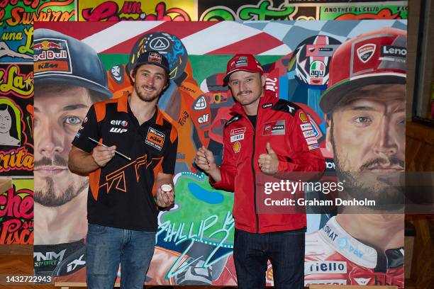 Jack Miller and Remy Gardner of Australia pose in front of an artwork by Justine Millsom and Marco Pennacchia during a media call at Duckboard Place...