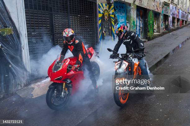 Jack Miller and Remy Gardner of Australia pose as they ride their motorcycles along Duckboard Place to ACDC Lane during a MotoGP preview media...