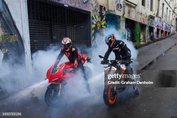 Jack Miller and Remy Gardner of Australia pose as they ride their motorcycles along Duckboard Place to ACDC Lane during a MotoGP preview media...