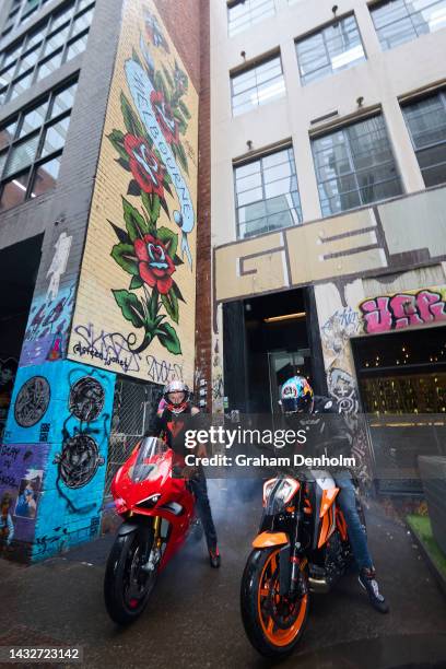 Jack Miller and Remy Gardner of Australia pose as they ride their motorcycles along Duckboard Place to ACDC Lane during a MotoGP preview media...