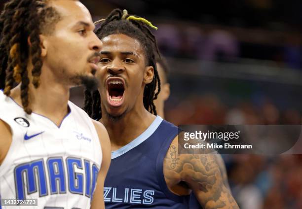 Ja Morant of the Memphis Grizzlies reacts to a play during a preseason game against the Orlando Magic at Amway Center on October 11, 2022 in Orlando,...