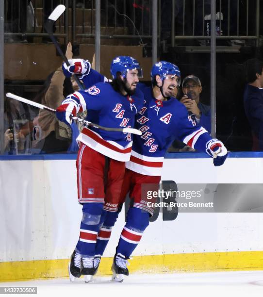 Mika Zibanejad of the New York Rangers celebrates his third period goal against the Tampa Bay Lightning along with Chris Kreider at Madison Square...