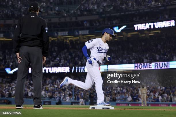 Trea Turner of the Los Angeles Dodgers rounds the bases after hitting a solo home run during the first inning in game one of the National League...