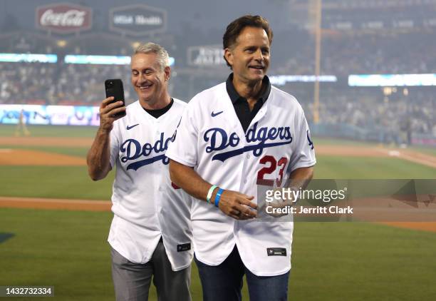 Former LA Dodgers Steve Sax and Eric Karros attend game one of the National League Division Series against the San Diego Padres at Dodger Stadium on...