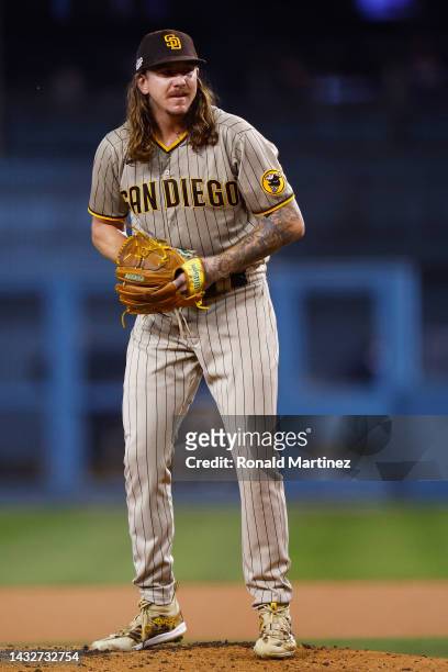 Mike Clevinger of the San Diego Padres pitches during the first inning in game one of the National League Division Series against the Los Angeles...