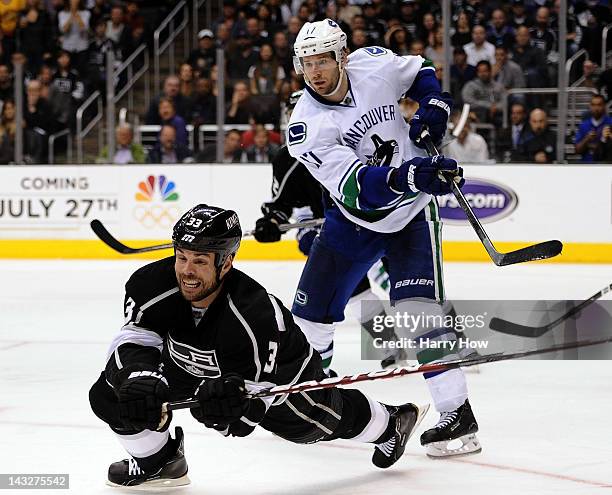 Willie Mitchell of the Los Angeles Kings dives for a puck in front of Ryan Kesler of the Vancouver Canucks during a 3-1 Canuck win at Staples Center...