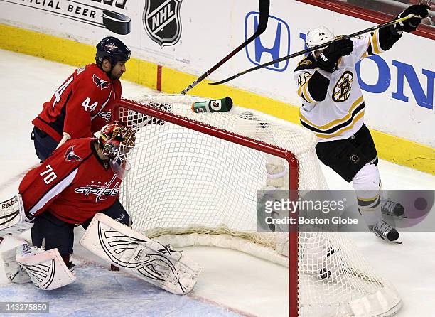 Washington Capitals goalie Braden Holtby gets a good look at Boston Bruins center David Krejci goal that gave Boston a 2-1 lead during the first...
