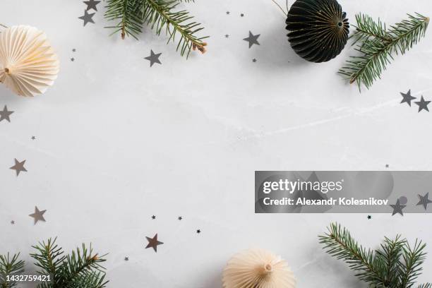 christmas border with xmas tree and decoration on light marble background. winter holiday, christmas background - christmas border stock pictures, royalty-free photos & images