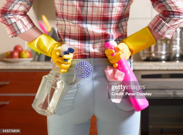 girl preparing to spring clean kitchen - cleaning house stock-fotos und bilder