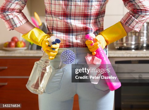 Girl preparing to spring clean kitchen Girl preparing to spring clean kitchen