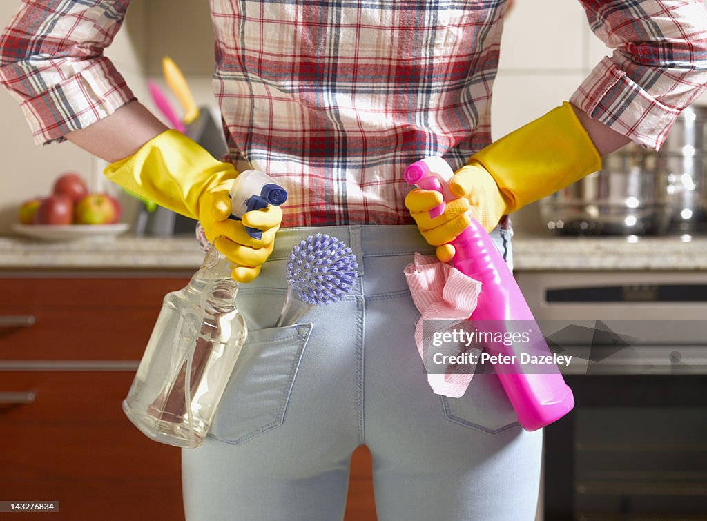 Girl preparing to spring clean kitchen