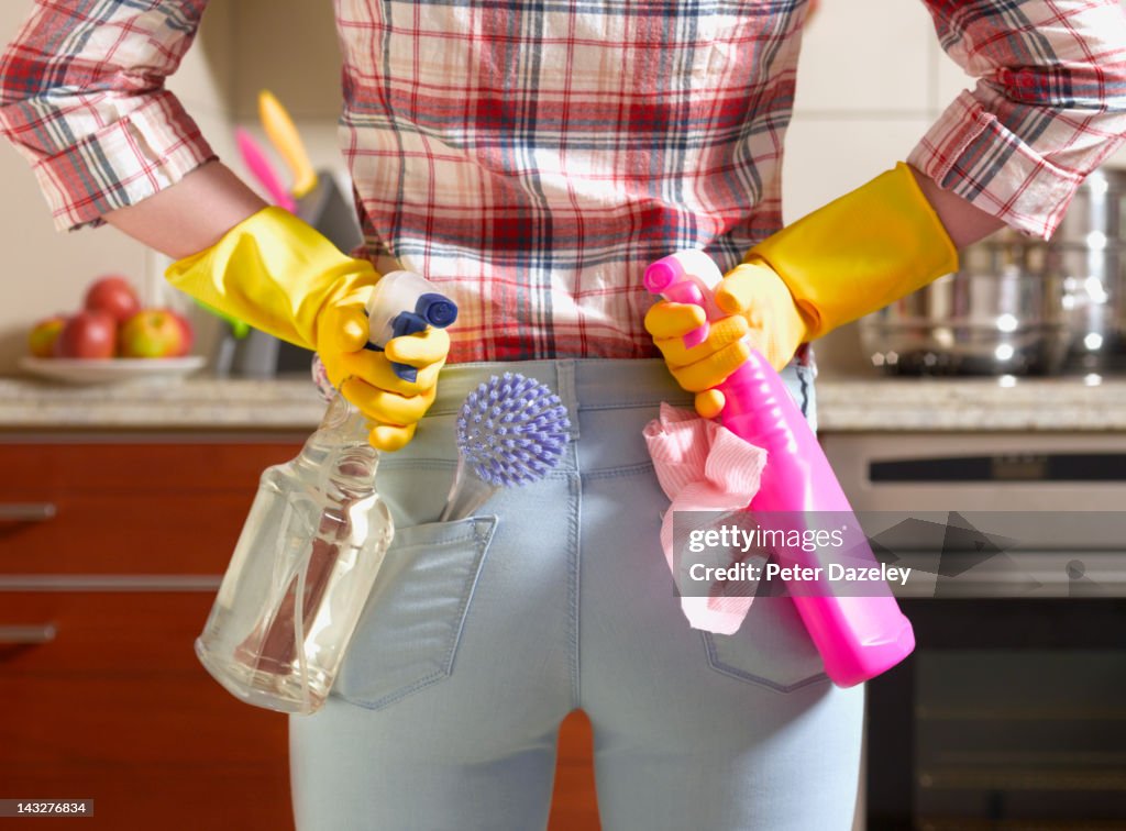 Girl preparing to spring clean kitchen