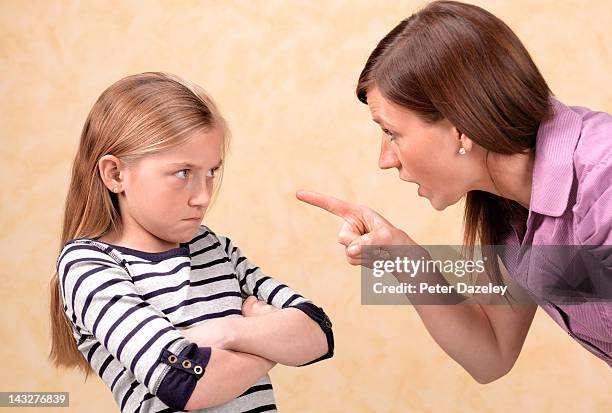daughter being told off by her mother - challenge authority stock pictures, royalty-free photos & images