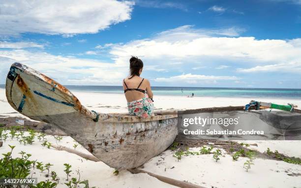 female tourist in sailing boat at sea, moment of melancholy, kenya, africa travel 2022. - mombasa stock pictures, royalty-free photos & images