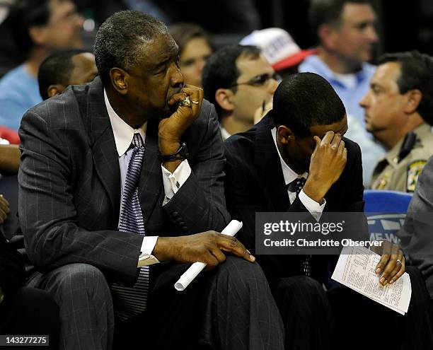 Charlotte Bobcats head coach Paul Silas, left, and assistant coach Stephen Silas watch as their team plays the Sacramento Kings during the second...