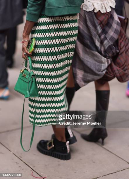 Fashion week guest's seen wearing colorful looks with a green Hermes kelly bag, outside Halpern Show during London Fashion Week, on September 18,...
