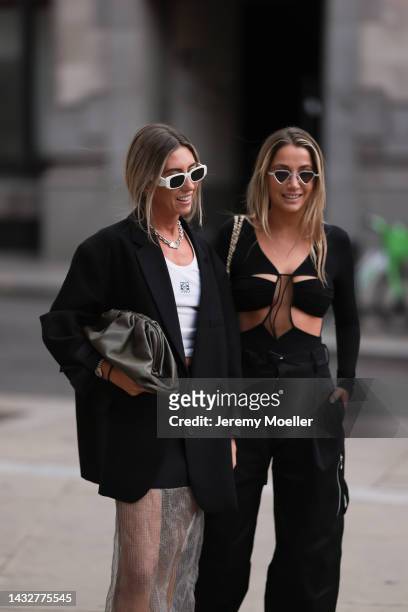 Hannah Lewis and Nadia Phillips seen wearing Bottega Veneta trousers, Loewe shirt, The Frankie shop blazer, Prada skirt and Nensi Dojaka top, outside...
