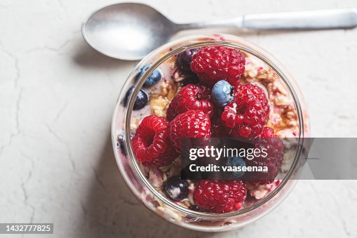 Overnight oatmeal with berry, peanut butter and maple syrup in jar. Healthy breakfast concept. Overnight oatmeal with berry, peanut butter and maple syrup in jar. Healthy breakfast concept.