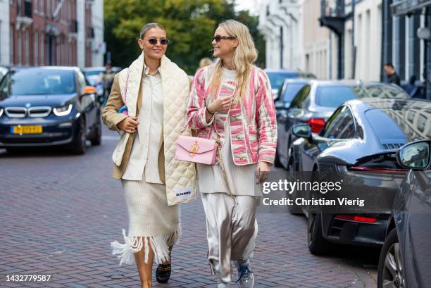 Hollie Mercedes Peters wears creme white fringed skirt H&M, black shoes Gucci Cara loafers, beige brown blazer Arket, latte puffer scarf Jil Sander,...