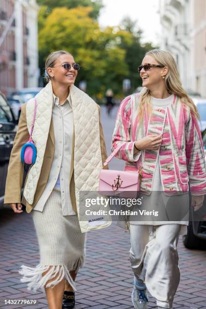 Hollie Mercedes Peters wears creme white fringed skirt H&M, black shoes Gucci Cara loafers, beige brown blazer Arket, latte puffer scarf Jil Sander,...