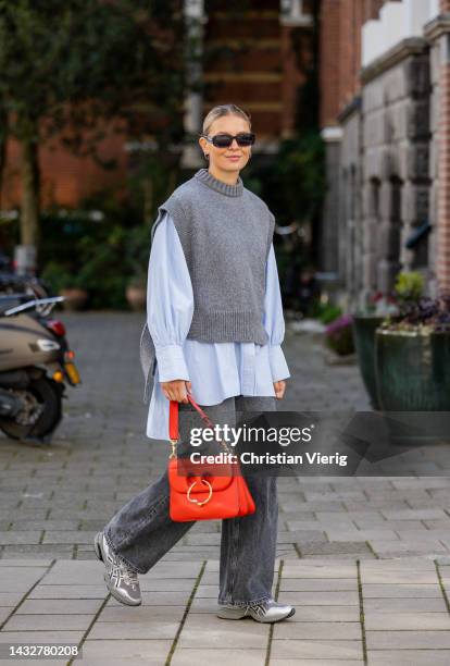 Hollie Mercedes Peters wears denim jeans Samsoe Samsoe, shoes/sneakers ASICS gel-1090v2, white button shirt Topshop, grey knit the knotty ones, red...