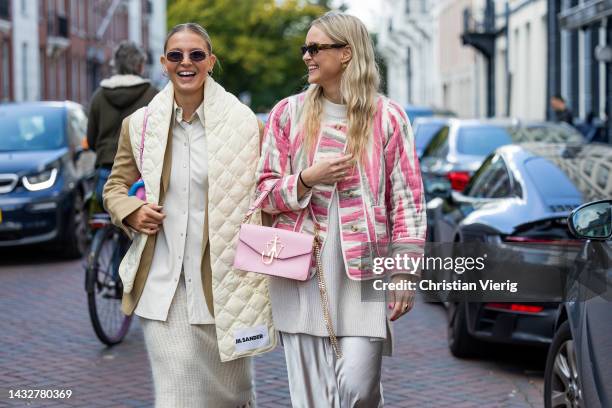 Hollie Mercedes Peters wears creme white fringed skirt H&M, black shoes Gucci Cara loafers, beige brown blazer Arket, latte puffer scarf Jil Sander,...