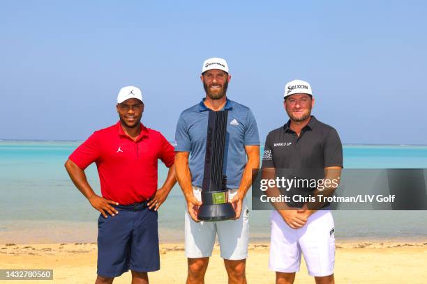 Team Captain Dustin Johnson of 4 Aces GC, Harold Varner III of Niblicks GC and Graeme McDowell of Cleeks GC pose with the LIV Jeddah trophy on the...