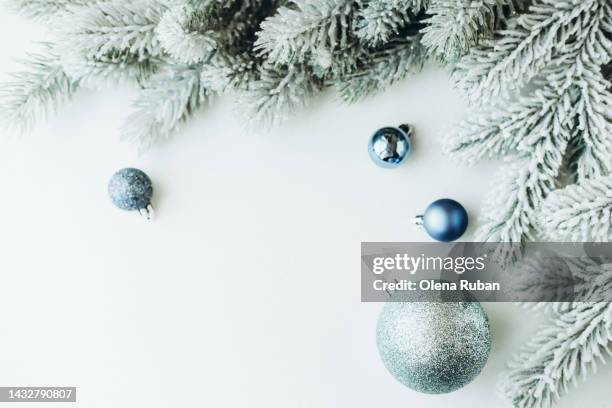 blue xmas balls and snowy spruce branches. - spruce branch stock pictures, royalty-free photos & images