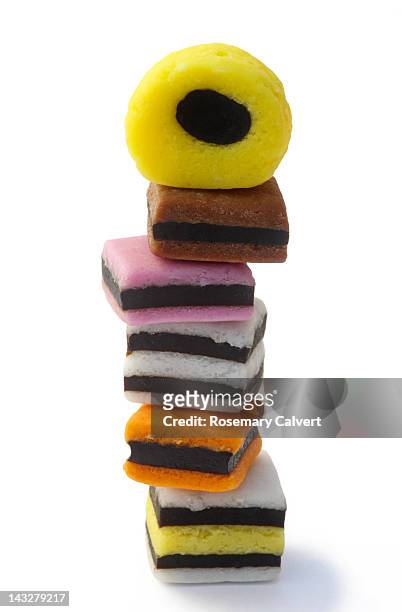 tower created with six assorted liquorice sweets - allsorts stock pictures, royalty-free photos & images