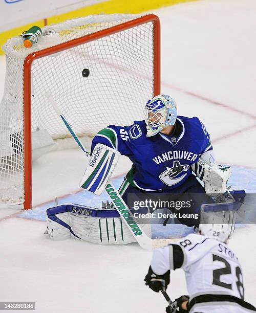 Jarret Stoll of the Los Angeles Kings shoots the puck past Cory Schneider of the Vancouver Canucks at 4:27 of the OT period in Game Five of the...