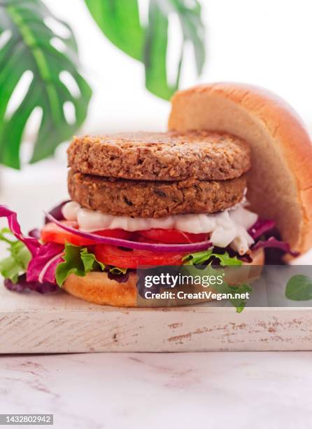 double vegan soy and vegetables burger - meat substitute stock pictures, royalty-free photos & images