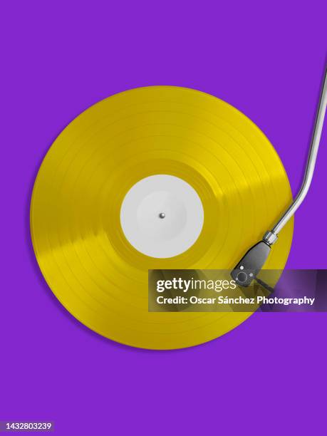 top view of yellow 12 inch vinyl record - gramophone stock pictures, royalty-free photos & images