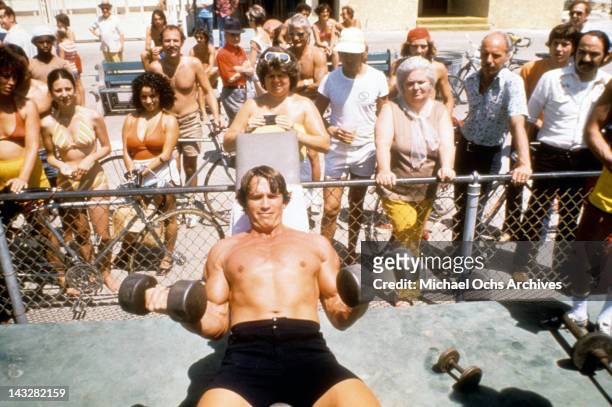 Austrian Bodybuilder Arnold Schwarzenegger lifts weights at Muscle Beach in Venice in August 1977 in Los Angeles, California.